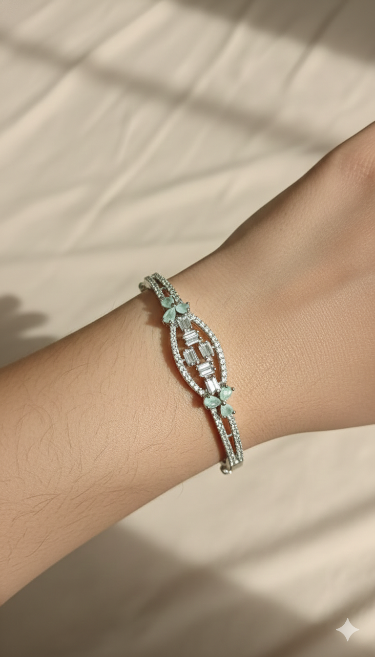 Silver-Toned Oval Crystal Bangle Bracelet with Floral Accent