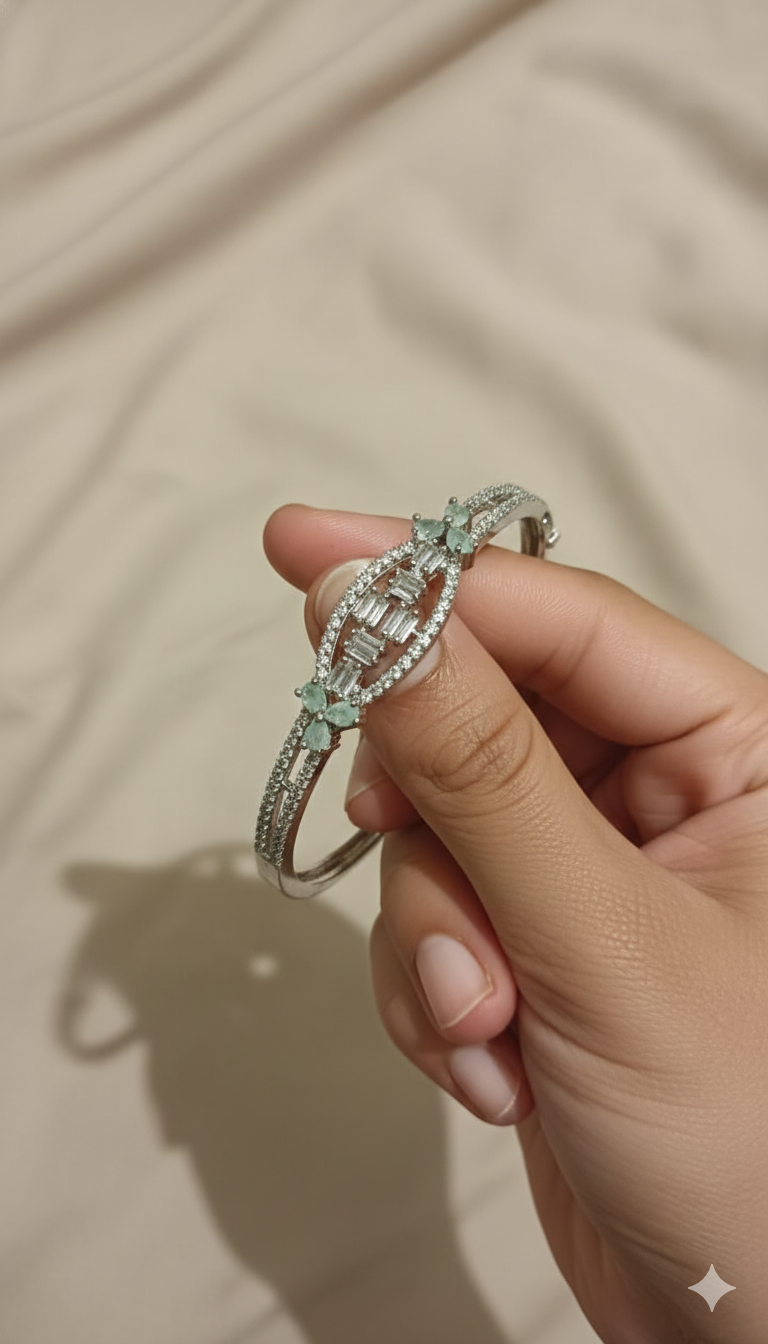 Silver-Toned Oval Crystal Bangle Bracelet with Floral Accent